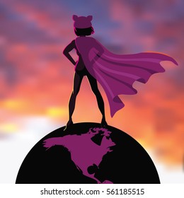 Superhero woman in a pink pussy cat knit cap and cape heroically standing atop the earth while overlooking the sunrise or sunset. 