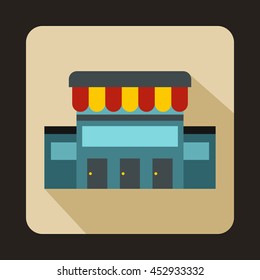 Supermarket building icon in flat style on a baby blue background