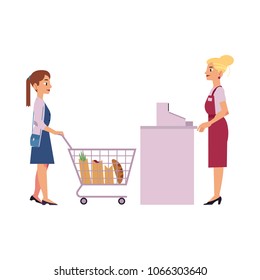 Supermarket cash desk with female cashier in uniform and apron behind equipment and young woman with food goods in storage hand shopping cart isolated on white background, vector illustration.