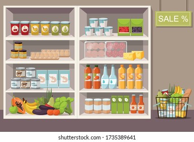 Supermarket interior with shelves full of various products. Full shopping cart.  