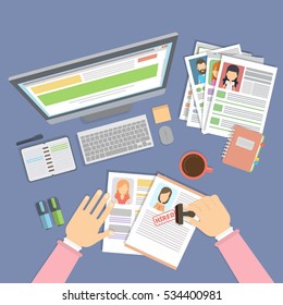 Supervising and accepting the resume. Director considering cv, finding new staff. Office desktop topview.