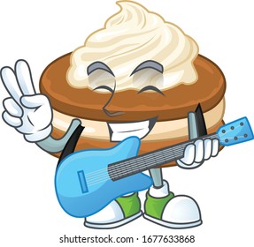 Supper talented white cream alfajor cartoon design with a guitar