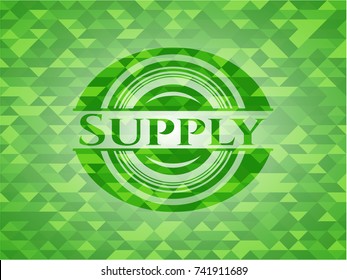 Supply green emblem with triangle mosaic background