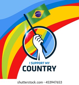 I Support Brazil. Hand holding the Country flag - abstract background Man Holding Flag in Rio Olympics 2016