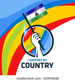 I Support Lesotho. Hand holding the Country flag - abstract background Man Holding Flag in Rio Olympics 2016