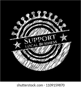  Support Local Business written on a blackboard