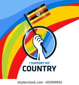 I Support Uganda. Hand holding the Country flag - abstract background Man Holding Flag in Rio Olympics 2016