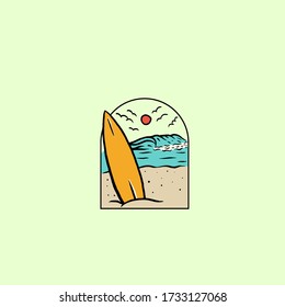 surf boards on the beach with big waves