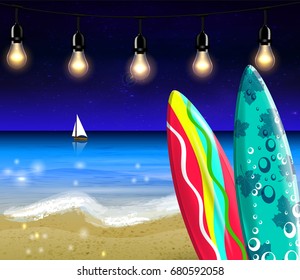 Surf boards on beach at night