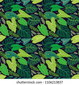 Surface design with tropical leaves on a dark background. Vector seamless pattern with exotic plants. Summer bright background. Print in the style of the jungle with Hawaiian motifs.