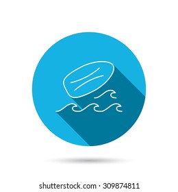 Surfboard icon. Surfing waves sign. Blue flat circle button with shadow. Vector