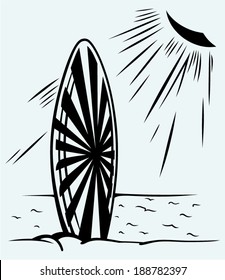 Surfboard on a beach. Isolated on blue background