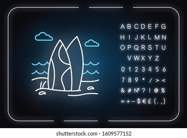 Surfboards on the beach neon light icon. Surf sea waves. Trip to Indonesia. Ocean surfing. Tropical island sea coast. Glowing sign with alphabet, numbers and symbols. Vector isolated illustration