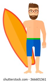 Surfer holding surfboard.