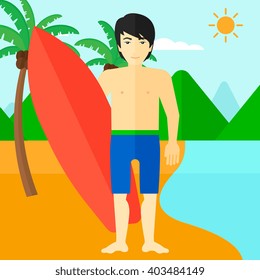 Surfer holding surfboard.
