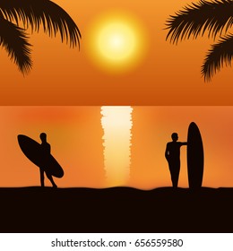 Surfers on the sunset beach