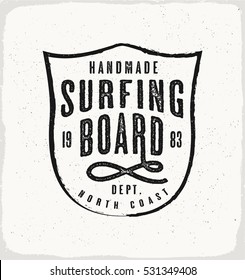 Surfing Board print in black and white for t-shirt or apparel. Retro beach style graphic with old school typography for fashion and printing. Vintage effects are easily removable.