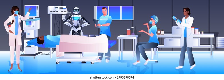 surgeons with robotic assistant making operation to patient lying on bed emergency medical treatment