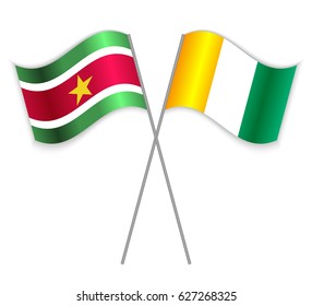 Surinamese and Ivorian crossed flags. Suriname combined with Ivory Coast isolated on white. Language learning, international business or travel concept.
