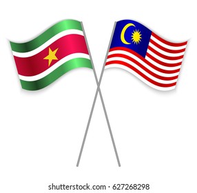Surinamese and Malaysian crossed flags. Suriname combined with Malaysia isolated on white. Language learning, international business or travel concept.