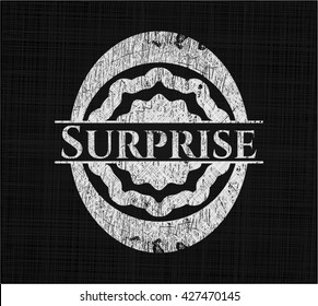 Surprise chalk emblem written on a blackboard