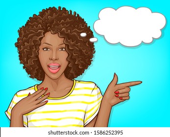 Surprised african american woman with afro hair and open mouth. Delighted black girl pointing by finger to big sale or great offer. Vector pop art illustration of dark skin lady with speech bubble