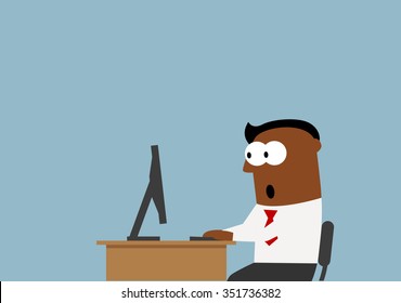 Surprised black businessman goggled at the desktop monitor with wide opened eyes