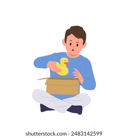 Surprised boy child cartoon character carrying rubber duck toy after cardboard box unpacking