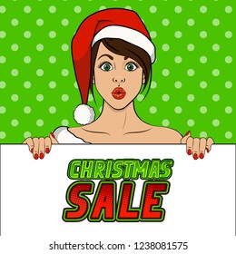 Surprised girl in santa claus hat holding a advertising poster. Christmas banner template. Green polka dots background. Vector illustration in pop art style.