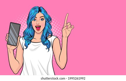 Surprised happy brunette woman showing blank smartphone screen and pointing while looking with open mouth over pink background Pop Art Comic Style