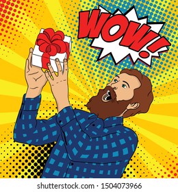 Surprised happy man with a beard in a plaid shirt with an open mouth raises his hands to a gift, shouting about advertising. Pop art male face, wow hipster. Vector illustration in retro comic style.