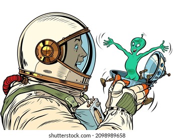 A surprised male astronaut looks at an alien in a festive UFO flying saucer box. Pop Art Retro Vector Illustration 50s 60s Vintage kitsch Style