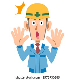 Surprised man on construction site in blue work clothes