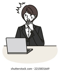 Surprised woman in suit looking at computer screen