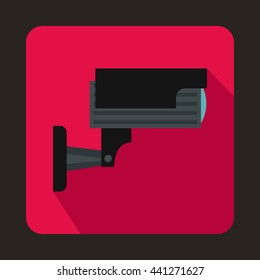 Surveillance camera icon in flat style on a pink background