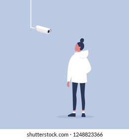 Surveillance. Young female character looking at the CCTV camera. Spying technologies. Flat editable vector illustration, clip art