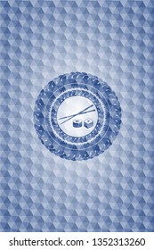 sushi icon inside blue emblem with geometric pattern.