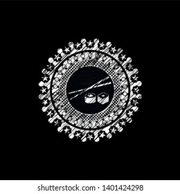 sushi icon inside chalk emblem written on a blackboard