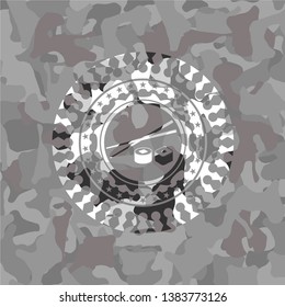 sushi icon on grey camo pattern