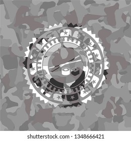 sushi icon on grey camouflage pattern