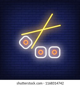 Sushi rolls with chopsticks neon sign. Food, restaurant, Japanese cuisine. Advertisement design. Night bright neon sign, colorful billboard, light banner. Vector illustration in neon style.