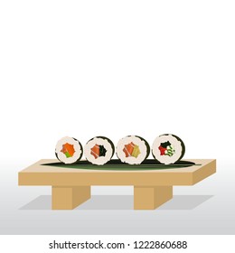 Sushi stand with rolls, salmon,tuna, tamago, avocado and tobiko.
