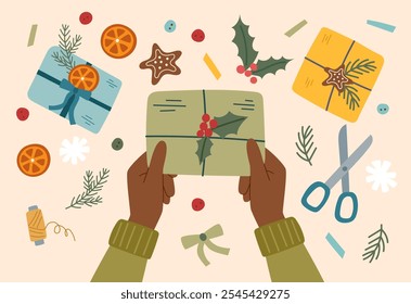 Sustainable Christmas concept. Eco friendly packaging of Christmas gift. Hands holding a wrapped Christmas present.