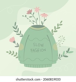 Sustainable Clothes Or Slow Fashion Motivational Image Concept. The Idea Is To Reuse Old Clothes To Protect The Environment. Isolated Image Of And Old Sweater And Flowers.