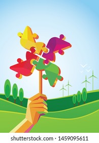 Mano humana sosteniendo molino de viento que representa el desarrollo social. Concepto de cuidado del medio ambiente para la ayuda a la naturaleza.  central eólica. Comunidad sustentable con turbina de molino eólico y naturaleza en la parte trasera.
