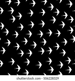 Swallow bird seamless pattern on a black background