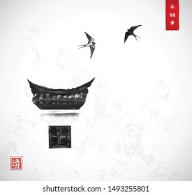 Swallow birds flying over the traditional window with typical Chinese design elements on white wall. Traditional oriental ink painting sumi-e, u-sin, go-hua. Hieroglyphs - eternity, freedom, happiness