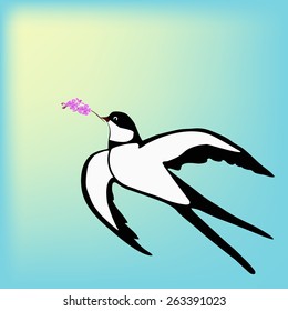 Swallow with a small sprig of lilac on a blue sky background