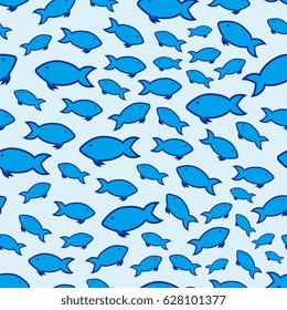 A swarm of blue fish swimming in the water