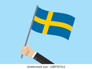 Sweden waving flag. Hand holding Swedish flag. National symbol. Vector illustration. 